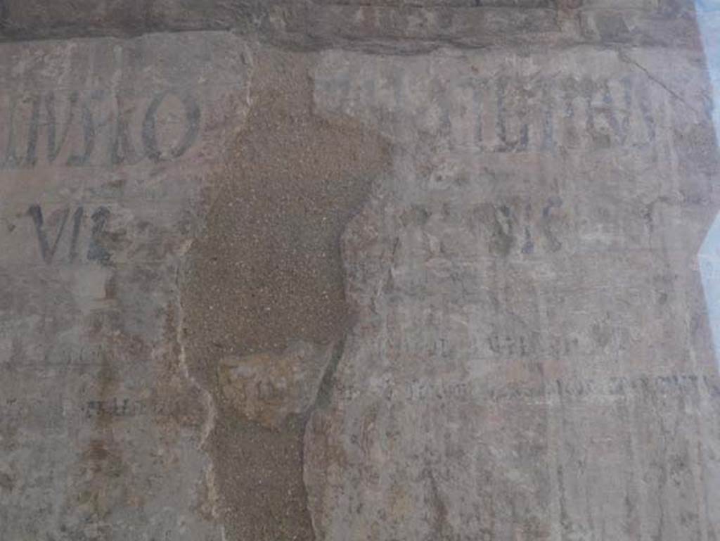 VI 12, Herculaneum, August 2013. Detail of graffiti on north-east corner of Insula VI, adjacent to the shop at VI.12. Photo courtesy of Buzz Ferebee.